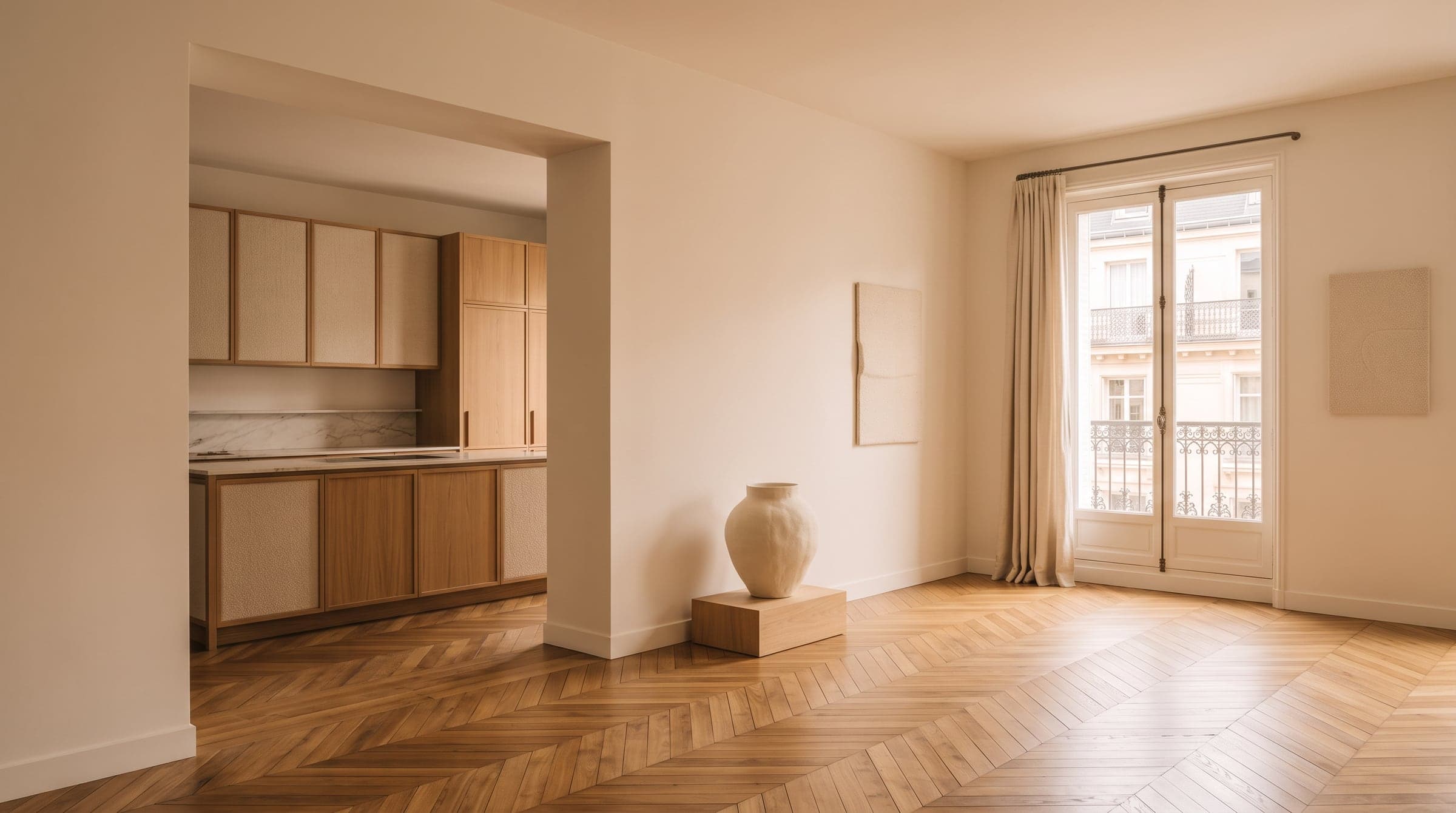 A sunlit Paris living room with a wall opening onto the kitchen, showing the layout before any finishes are chosen