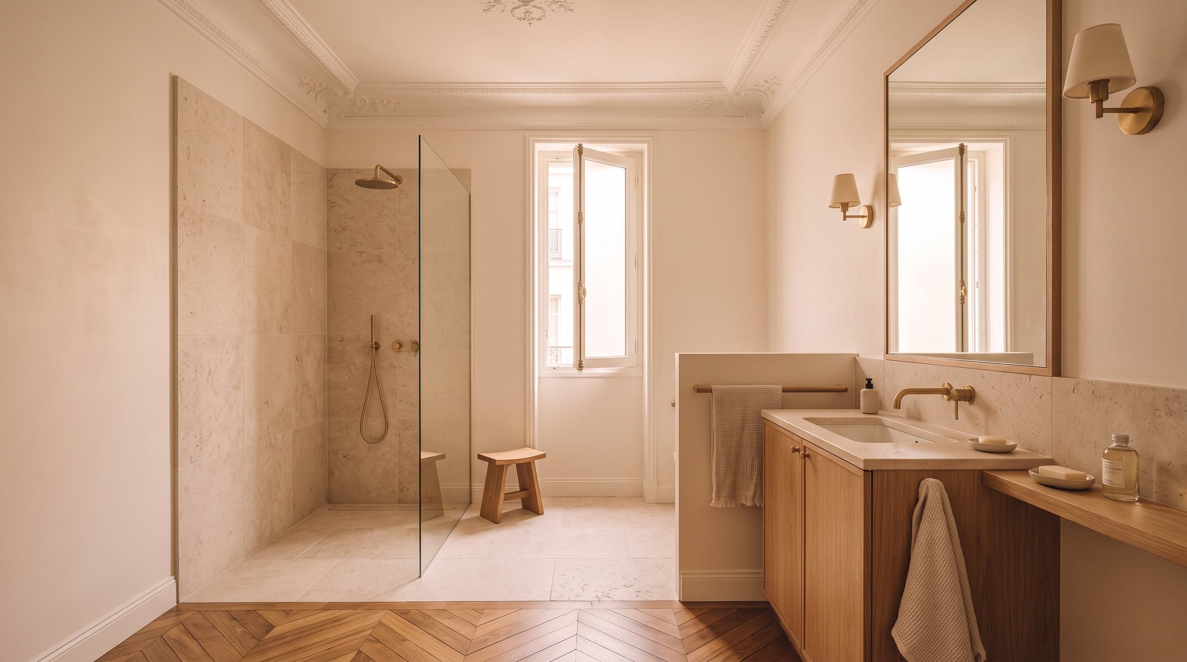 Former Haussmann service room reworked into a bright ensuite bathroom with fitted oak joinery